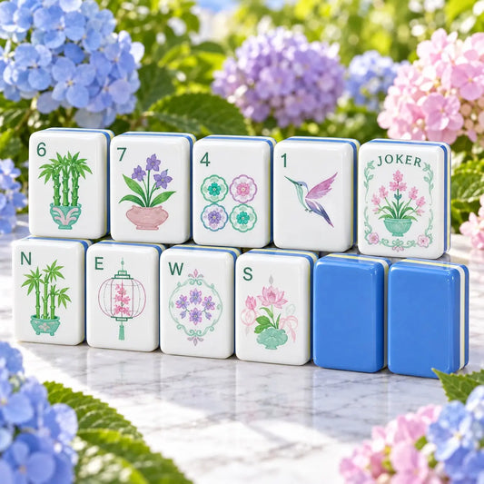 Blue, green and white botanical mahjong tiles set laid out for a first game